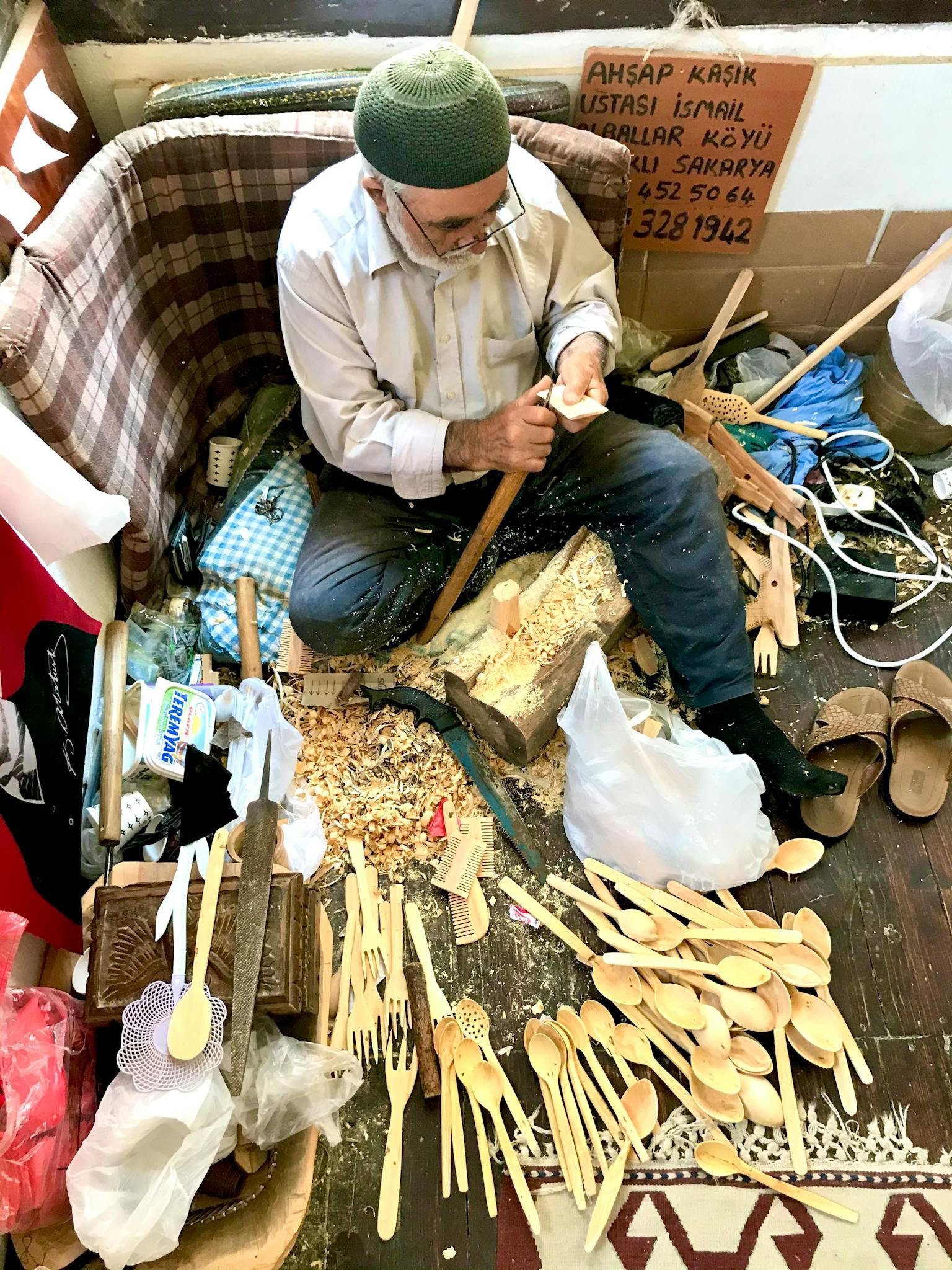 Craftsman carving wooden spoons using traditional methods in Taraklı, Turkey.